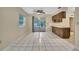 Open concept dining area features tile flooring, wood accents, and natural light at 2169 Danforth Rd, Spring Hill, FL 34608