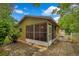 Back exterior view of home with sunroom and access to backyard area at 2169 Danforth Rd, Spring Hill, FL 34608