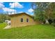 Back exterior view of home with mature foliage at 2169 Danforth Rd, Spring Hill, FL 34608