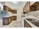 Spacious kitchen featuring white appliances and wood cabinetry at 2169 Danforth Rd, Spring Hill, FL 34608