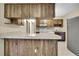 A kitchen with wood cabinets and white appliances at 2169 Danforth Rd, Spring Hill, FL 34608
