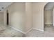 Spacious room with neutral walls and white ceramic tile flooring creating a bright and airy atmosphere at 2169 Danforth Rd, Spring Hill, FL 34608
