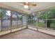 Sunroom with carpet and large windows offering backyard views at 2169 Danforth Rd, Spring Hill, FL 34608