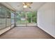 Cozy sunroom with neutral carpet and large windows offering backyard views at 2169 Danforth Rd, Spring Hill, FL 34608