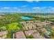Expansive aerial shot of a residential neighborhood with multiple lakes, pools, and green spaces at 2209 Kings Palace Dr # 21-204, Riverview, FL 33578