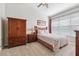 Comfortable bedroom with a ceiling fan, wooden furniture, and soft, patterned bedding at 2209 Kings Palace Dr # 21-204, Riverview, FL 33578