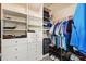 Organized walk-in closet with shelves, drawers, and hanging rods for efficient storage at 2209 Kings Palace Dr # 21-204, Riverview, FL 33578