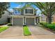 Charming two-story townhome with two-car garage and well-maintained landscaping at 2209 Kings Palace Dr # 21-204, Riverview, FL 33578