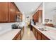 Spacious kitchen with stainless appliances, tile floors, and views into the dining area at 2209 Kings Palace Dr # 21-204, Riverview, FL 33578