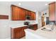 Modern kitchen with stainless steel appliances, dark wood cabinets, and white countertops at 2209 Kings Palace Dr # 21-204, Riverview, FL 33578