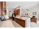 Eat-in kitchen featuring sleek appliances, dark wood cabinets, and bright countertops at 2209 Kings Palace Dr # 21-204, Riverview, FL 33578