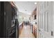 Open concept kitchen with dark wood cabinets, and an adjacent dining area at 2209 Kings Palace Dr # 21-204, Riverview, FL 33578