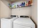 Well-equipped laundry area with modern washer and dryer for convenient home care at 2209 Kings Palace Dr # 21-204, Riverview, FL 33578