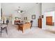 Bright and airy living room with high ceilings, neutral carpet, and elegant furnishings at 2209 Kings Palace Dr # 21-204, Riverview, FL 33578