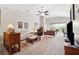 Spacious living room with vaulted ceiling, plush carpet and access to a screened porch at 2209 Kings Palace Dr # 21-204, Riverview, FL 33578