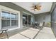 Comfortable screened patio with ceiling fan, ideal for outdoor dining and relaxation at 2209 Kings Palace Dr # 21-204, Riverview, FL 33578