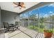 Relaxing screened patio with ceiling fan, perfect for enjoying the outdoors in comfort at 2209 Kings Palace Dr # 21-204, Riverview, FL 33578