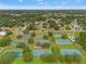 Aerial view featuring tennis courts in a well-maintained community at 23302 Lucerne Pl, Land O Lakes, FL 34639