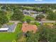 Aerial view of a neighborhood with community amenities including a pool, playground, and sports fields at 23302 Lucerne Pl, Land O Lakes, FL 34639