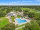 Aerial image showcasing community pool and recreational center amenities, including a swimming pool and tennis courts at 23302 Lucerne Pl, Land O Lakes, FL 34639