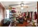 Bedroom with wood-look flooring, ceiling fan and generous closet space at 23302 Lucerne Pl, Land O Lakes, FL 34639