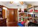 Bedroom featuring hardwood floors, a closet and a ceiling fan at 23302 Lucerne Pl, Land O Lakes, FL 34639