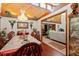 Bright dining room featuring a chandelier, wood floors, and an opening to the living room at 23302 Lucerne Pl, Land O Lakes, FL 34639