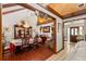 Traditional dining room featuring wood floors, a chandelier, and a formal dining set at 23302 Lucerne Pl, Land O Lakes, FL 34639