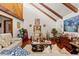 Inviting living room with vaulted ceilings, exposed beams, and ample natural light at 23302 Lucerne Pl, Land O Lakes, FL 34639