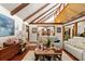 Cozy living room featuring a vaulted ceiling and an open floor plan perfect for entertaining at 23302 Lucerne Pl, Land O Lakes, FL 34639