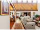 Spacious open-concept living area featuring tiled and hardwood floors, perfect for gatherings at 23302 Lucerne Pl, Land O Lakes, FL 34639