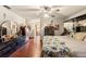Spacious main bedroom with hardwood floors, ceiling fan, and ensuite bathroom entrance at 23302 Lucerne Pl, Land O Lakes, FL 34639