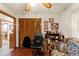 Cozy office space with wood floors, closet, and comfortable furnishings at 23302 Lucerne Pl, Land O Lakes, FL 34639