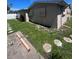 Back exterior view shows a manicured backyard at 3238 Coldwell Dr, Holiday, FL 34691