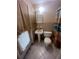 Modest bathroom featuring a pedestal sink and a standard toilet at 3238 Coldwell Dr, Holiday, FL 34691