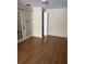 Bedroom features wood flooring and a pair of french doors at 3238 Coldwell Dr, Holiday, FL 34691