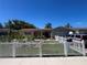 Charming single-story home with landscaped front yard and white picket fence at 3238 Coldwell Dr, Holiday, FL 34691