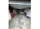 Spacious garage featuring ample storage space and potential for a workshop or parking at 3238 Coldwell Dr, Holiday, FL 34691