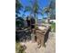 Backyard features an outdoor kitchen with a brick oven at 3238 Coldwell Dr, Holiday, FL 34691