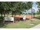 A baseball field with fencing and signage at Longleaf Veterans Park at 3450 Ferrell St, New Port Richey, FL 34655