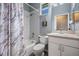 This bathroom features a shower-tub combo and a vanity with storage at 3450 Ferrell St, New Port Richey, FL 34655