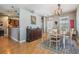 Dining area with hardwood floors and view of the adjacent kitchen at 3450 Ferrell St, New Port Richey, FL 34655