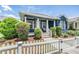 Charming home with a white picket fence, covered front porch, and lush landscaping at 3450 Ferrell St, New Port Richey, FL 34655