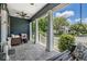 Inviting front porch with cozy seating and charming porch swing at 3450 Ferrell St, New Port Richey, FL 34655