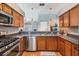 Open kitchen layout with stainless steel appliances and ample counter space at 3450 Ferrell St, New Port Richey, FL 34655