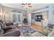 Bright living room with hardwood floors and built-in entertainment center at 3450 Ferrell St, New Port Richey, FL 34655