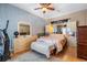 Cozy bedroom featuring hardwood floors, a ceiling fan, and built-in storage for a serene retreat at 3450 Ferrell St, New Port Richey, FL 34655