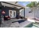 View of the patio with a ceiling fan, lounge furniture, and access to the swimming pool at 3450 Ferrell St, New Port Richey, FL 34655