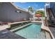 Private backyard features a sparkling pool with outdoor dining area at 3450 Ferrell St, New Port Richey, FL 34655