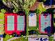 Aerial view of community sports courts, featuring tennis, volleyball and basketball at 3450 Ferrell St, New Port Richey, FL 34655